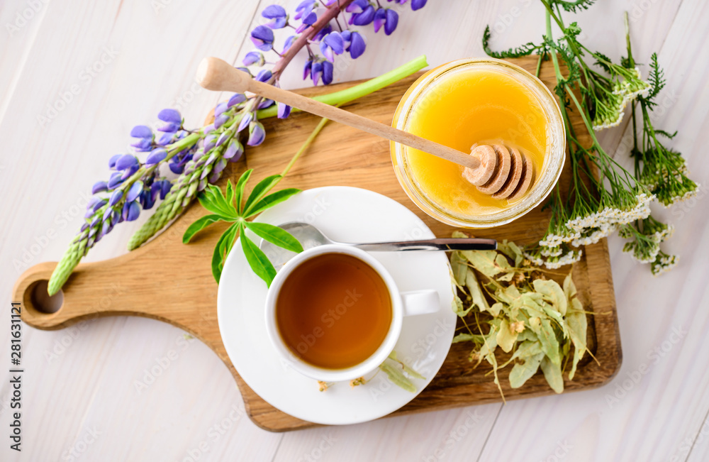 Cup with herbal tea and honey and dry herbal tea Cup with herbal tea and honey and dry herbal tea