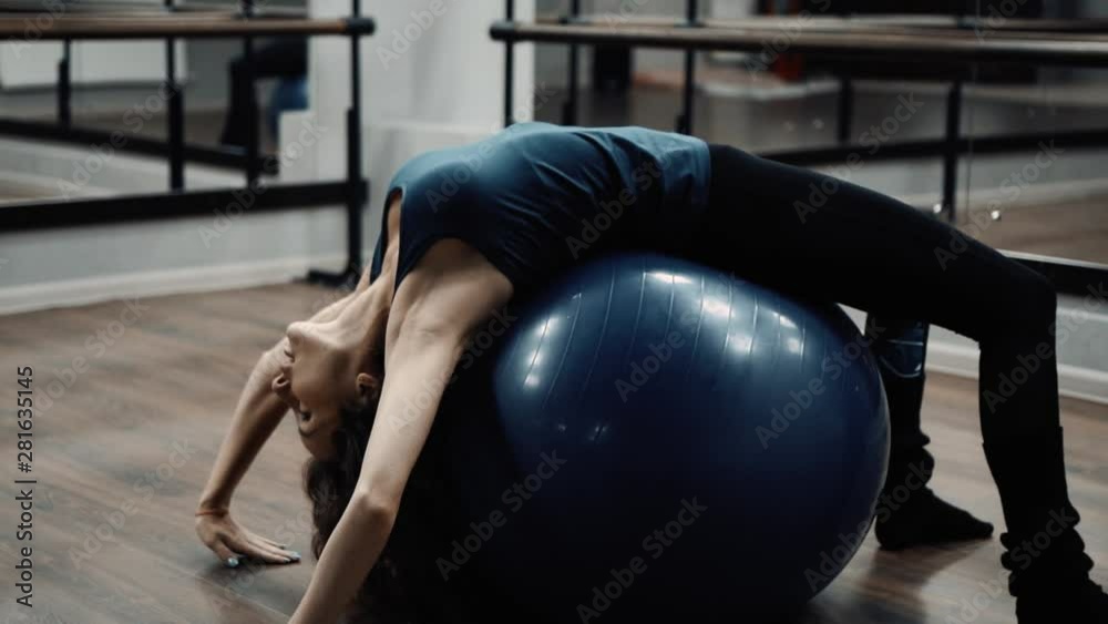 lovely girl does exercises in dance school