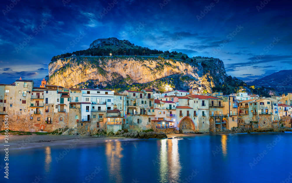 Sunset view of beautiful Cefalu, small resort town on Tyrrhenian coast of Sicily, Italy