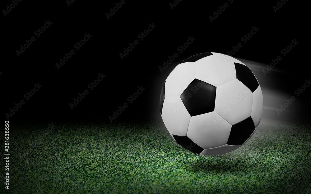 Soccer ball on green grass and black background