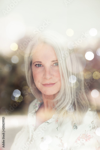 stunning beautiful and self confident best aged woman with grey hair smiling into camera, portrait 