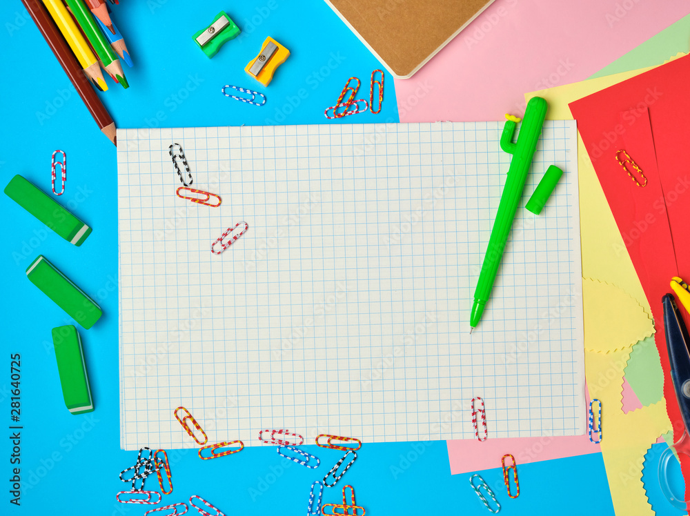 white squared paper from notebooks, wooden colored pencils, paper clips white squared paper from notebooks, wooden colored pencils, paper clips
