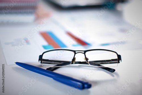 Group of multicolored office folders and glasses