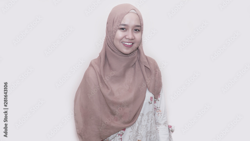 portrait of asian muslim woman with head scarf inside room indoors posing to camera portrait of asian muslim woman with head scarf inside room indoors posing to camera