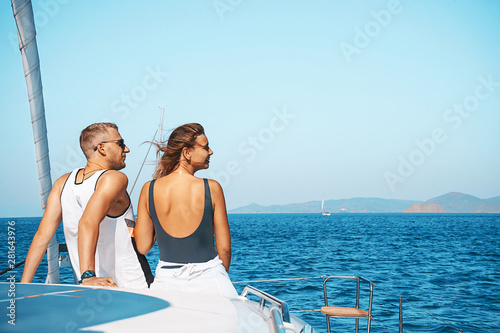 Couple in love on a sail boat yacht in the summer holiday vacation. © IrynaV