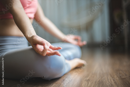 Wallpaper Mural Young woman practicing yoga in  bedroom house.Young people do yoga indoor.Close up hands in meditating gesture.  Torontodigital.ca