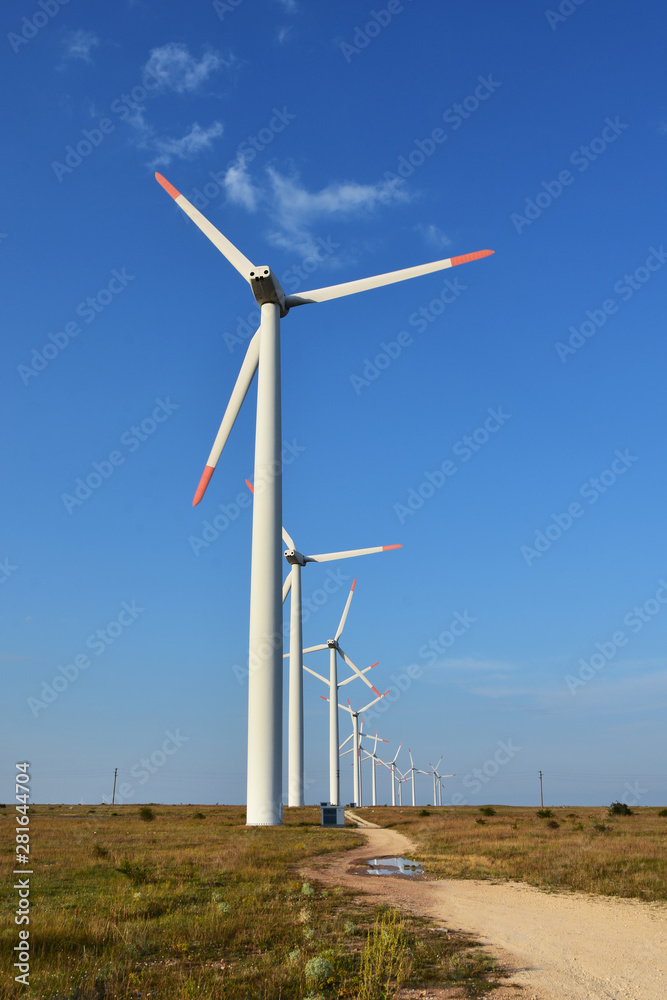 Fototapeta premium Wind generators in the field near Kaliakra Cape, Bulgaria. Renewable energy. Sustainable energy resource