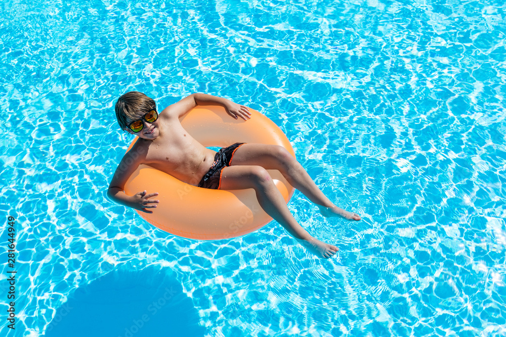 child smiling happily in the pool