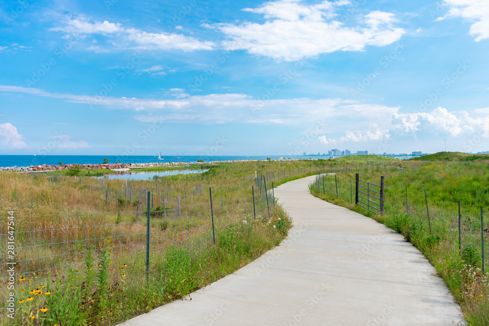 Curving Path with Native Plants at Northerly Island in Chicago during the Summer by Lake Michigan Curving Path with Native Plants at Northerly Island in Chicago during the Summer by Lake Michigan