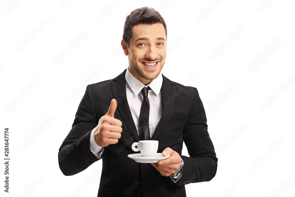 Businessman with a cup of espresso coffee showing thumbs up Businessman with a cup of espresso coffee showing thumbs up