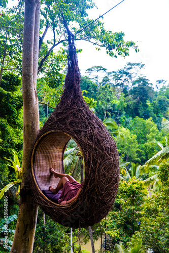 A female tourist is sitting...