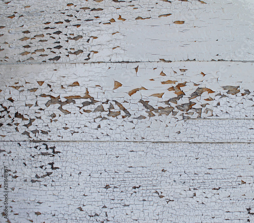 wooden surface covered with white chipped paint