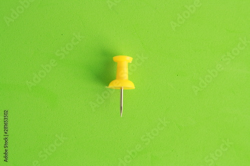 plastic thumbtacks in colorful background
