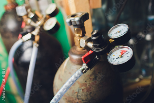 Bild auf Leinwand Close up gauges and valve on old nitrogen gas cylinder in laboratory