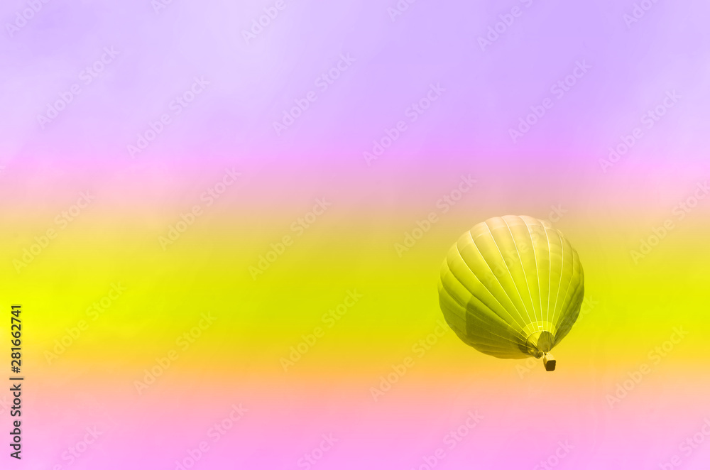 Obraz premium Travel, summer and tourism concept in trendy neon colors. Rainbow gradient background with copy space. Trip, journey background. Blue hot-air balloons flying over sky.