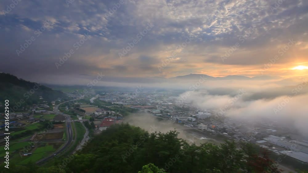 Mount Asama and Maruko city in fog seen from Maruko Castle, Japan Mount Asama and Maruko city in fog seen from Maruko Castle, Japan