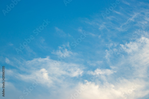 Fototapeta Naklejka Na Ścianę i Meble -  Abstract blurred background Blue sky with white clouds in sunlight.