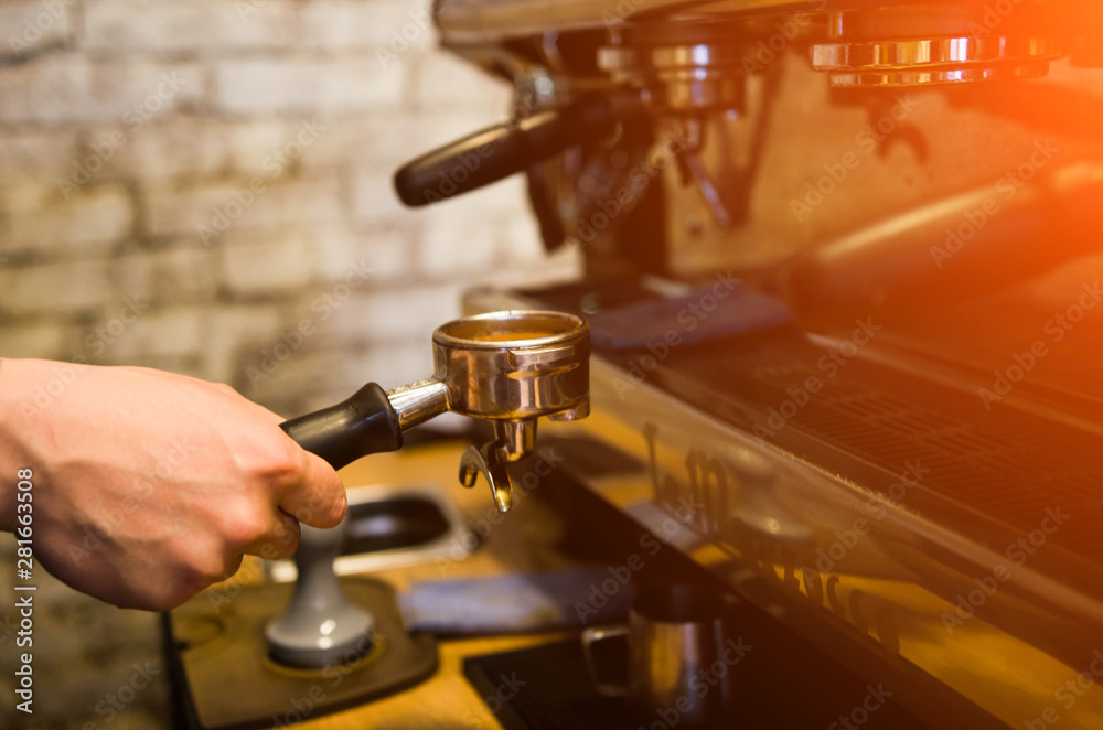 Close up of barista preparing fresh espresso on professional coffee machine Close up of barista preparing fresh espresso on professional coffee machine