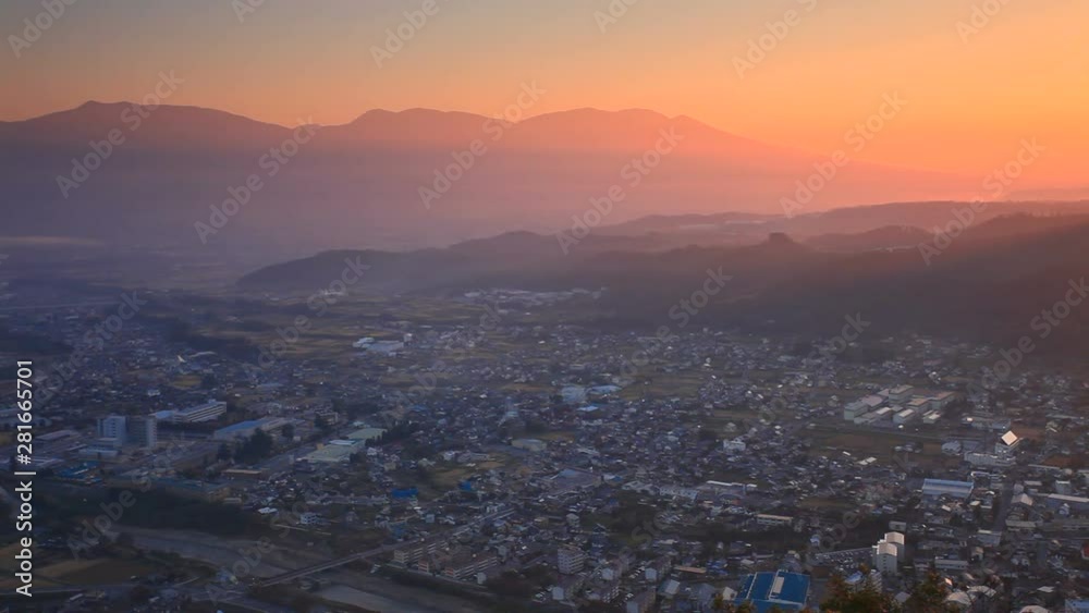Zoom out of Maruko city from Yoda Castle ruins at sunrise, Japan Zoom out of Maruko city from Yoda Castle ruins at sunrise, Japan
