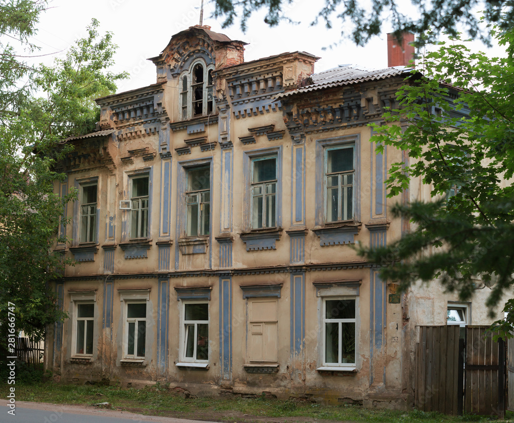 Fototapeta premium old stone house in russian provincial town at sunset concept of dying small russian towns