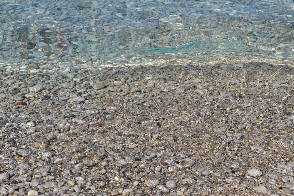 Abstract beach background texture with pebbles, sands and sea water in bodrum turkey