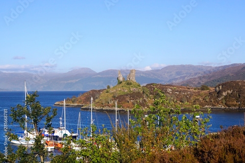 The ruins of castle Moil and Kyleakin harbour on the Isle of Skye photo