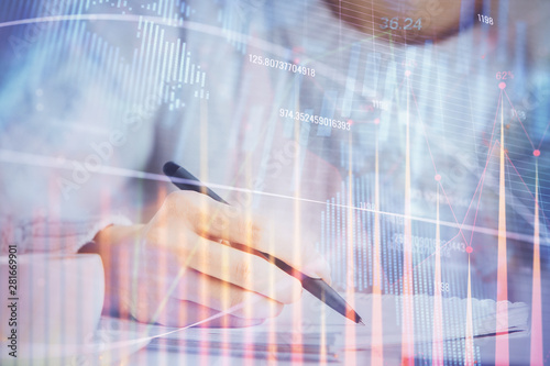 Forex chart displayed on woman's hand taking notes background. Concept of research. Multi exposure © peshkova