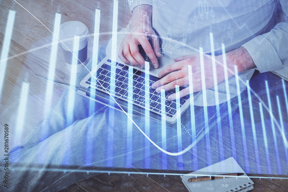 Forex graph with businessman working on computer in office on background. Concept of analysis. Double exposure. Forex graph with businessman working on computer in office on background. Concept of analysis. Double exposure.