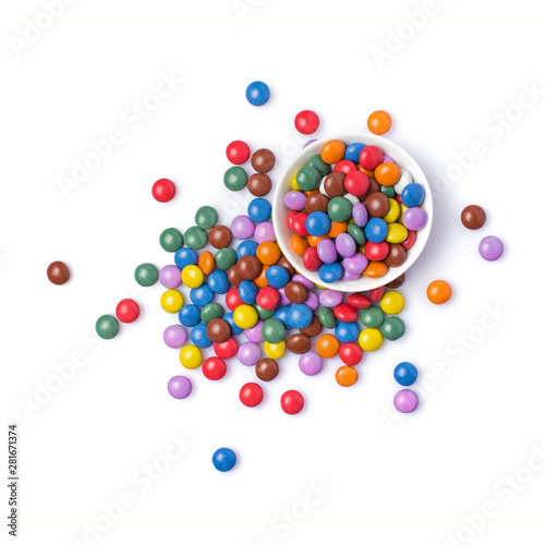 Sweet multicolored dragee in white bowl