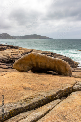 Muxia or Mugia rocky coastal view with Pedra dos Cadris rock on the Way of St. James, Camino de Santiago, Province of A Coruna, Galicia, Spain photo