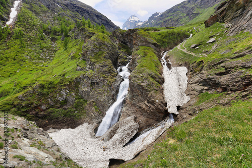 Beautiful waterfall in the way to Rifugio Benevolo, Val d'Aosta, Italy photo