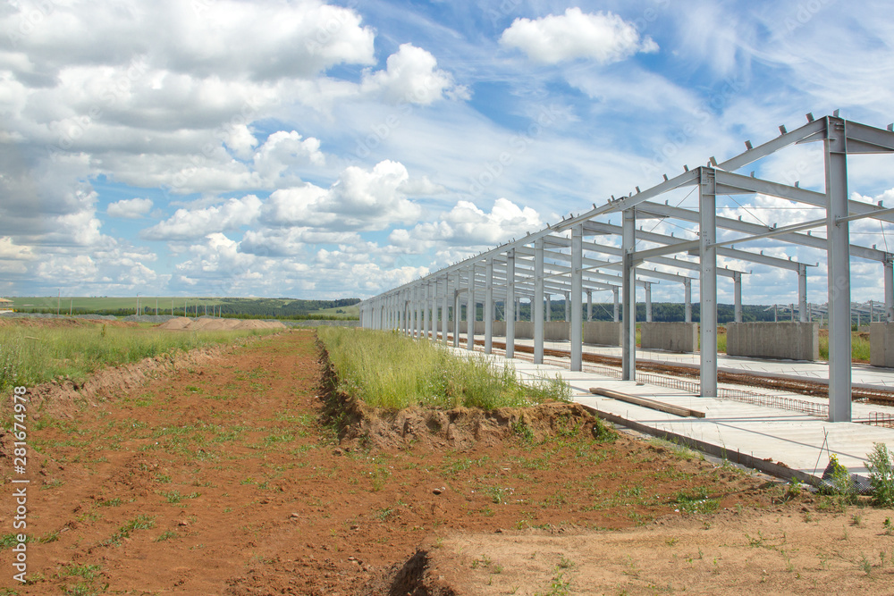 Metal construction on a concrete base. Construction of prefabricated buildings and structures for agriculture.