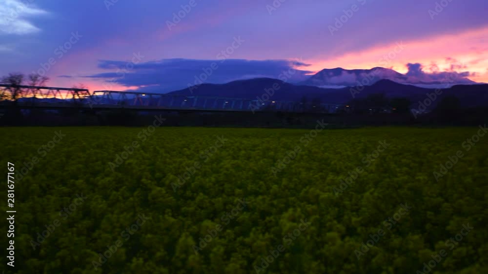 Sunset over Rapeseed field and mountains,  Obuse,  Kamitakai,  Nagano 