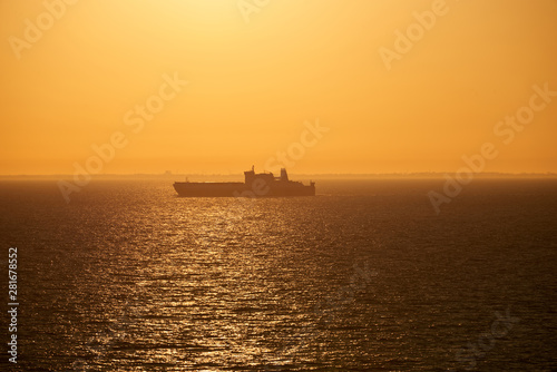 sunset above ocean while cruising through sea