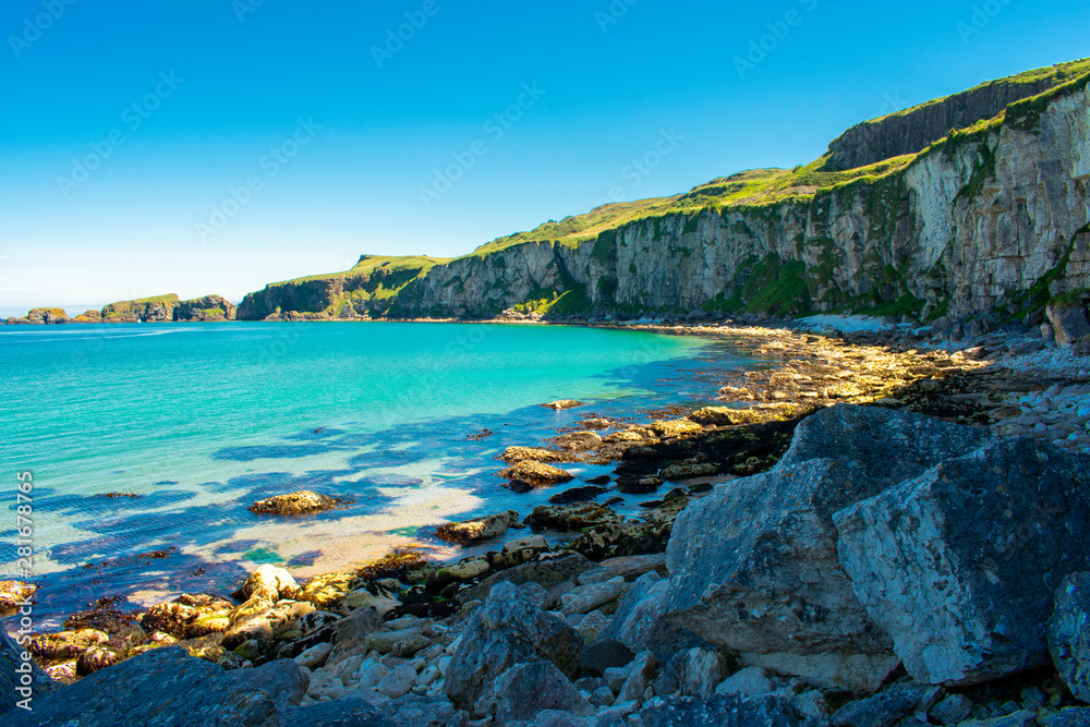 Carrick a Rede Rope Bridge in Ballintoy, Northern Ireland. Beautiful Landscape on Coast of Atlantic Ocean, Clear blue and green water 