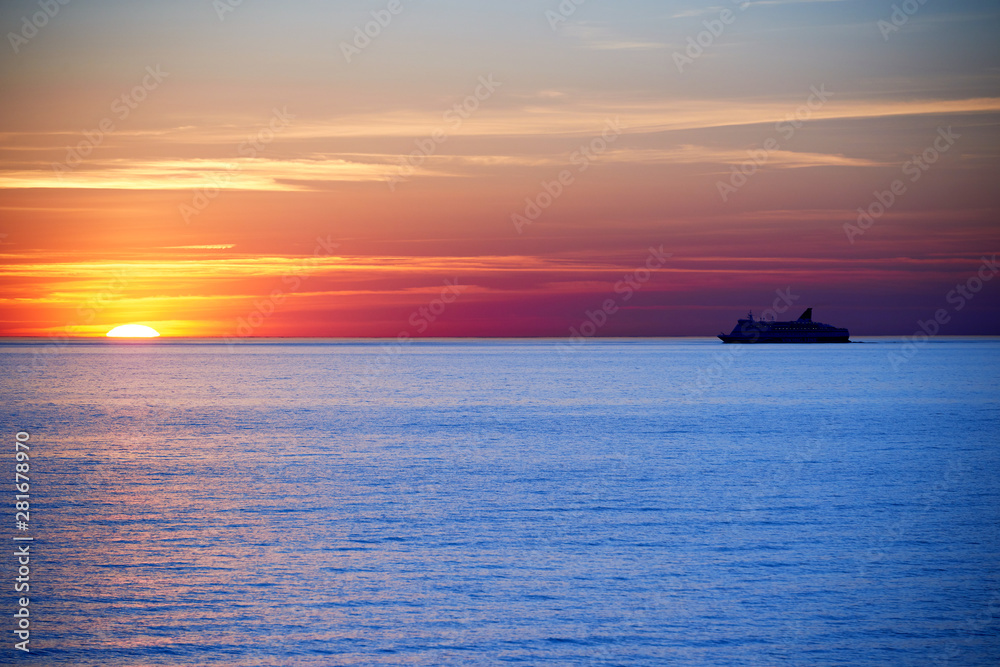 sunset above ocean while cruising through sea