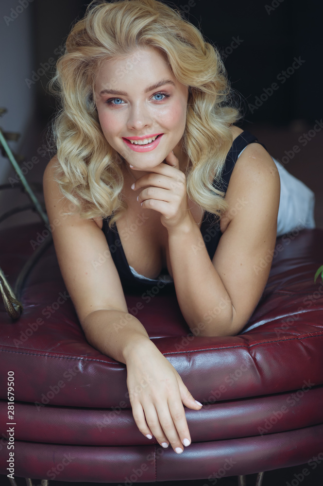 Beautiful Curly Hair. Smiling Girl With Healthy Wavy Long Blonde Hair. Portrait Happy Woman With Beauty Face, Sexy Makeup And Perfect Hair Curls. Volume, Hairstyle, Hairdressing Concept. Beautiful Curly Hair. Smiling Girl With Healthy Wavy Long Blonde Hair. Portrait Happy Woman With Beauty Face, Sexy Makeup And Perfect Hair Curls. Volume, Hairstyle, Hairdressing Concept.