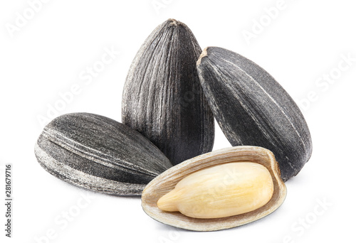 Close-up of delicious sunflower black seeds, isolated on white background photo