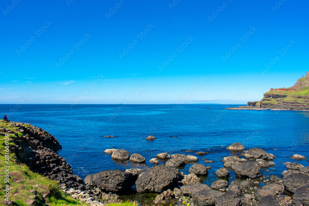 Giants Causeway on Coast of Atlantic Ocean in Northern Ireland. Beautiful landscape, summer time Giants Causeway on Coast of Atlantic Ocean in Northern Ireland. Beautiful landscape, summer time