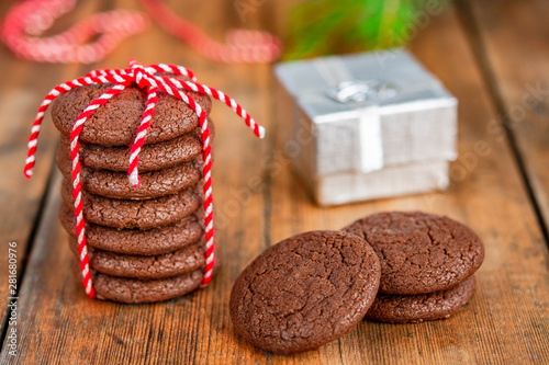 Chocolate cookies, gift and Christmas tree branches