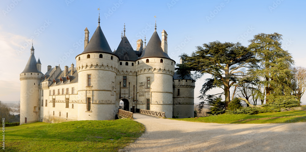 Chaumont Castle france - Panoramic wide view to the entrance and the garden with trees and grass at sunrise