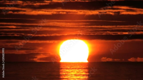 Sun rising above sea,  Betsukai,  Hokkaido,  Japan photo