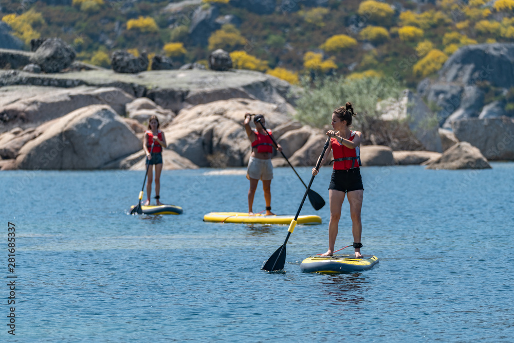 Naklejka premium Stand up paddle on a lake