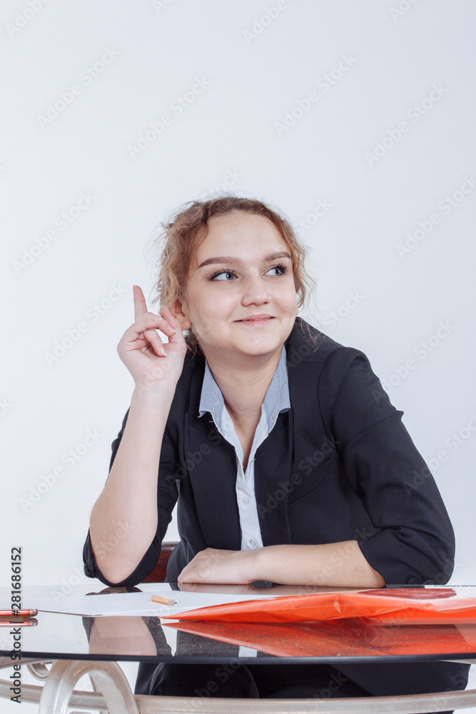 education, people, children and school concept - Portrait of young beautiful woman sitting at desk enjoying cup of coffee while working or studying at small home office or in the student dorm. Indoors education, people, children and school concept - Portrait of young beautiful woman sitting at desk enjoying cup of coffee while working or studying at small home office or in the student dorm. Indoors