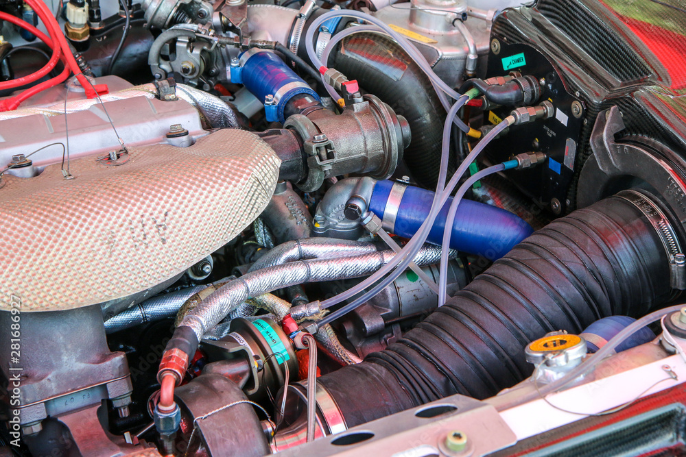 A detail of the sports car engine. It is a historic rallye car from the past. A detail of the sports car engine. It is a historic rallye car from the past.