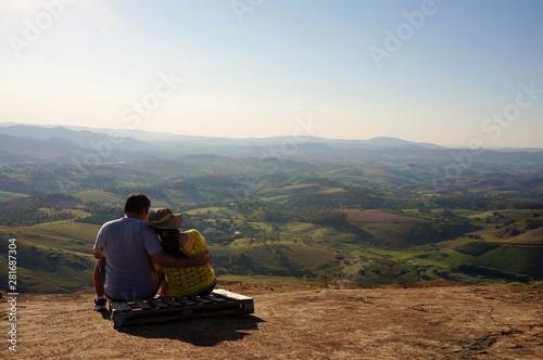 Romantic couple looks at the beautiful view of the Socorro City, Brazil