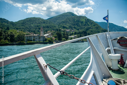 Travelling by a ship on the Como lake in a sunny summer day