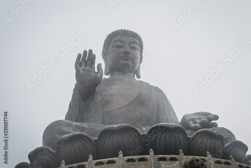 Tian Tan Buddha in misty weather. The second tallest bronze statue of Buddha Shakyamuni in the world, located at Ngong Ping, Lantau Island, Hong Kong photo