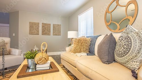 Panorama frame Beautiful living room with white sofa wood table fluffy pillows and carpet photo