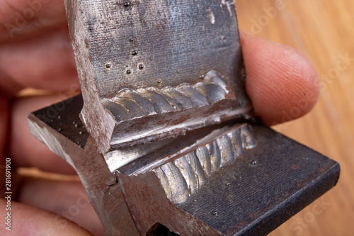 Canvas Print The fillet weld is rubbed with a angle grinder